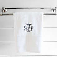 monogrammed bath towel in white hanging