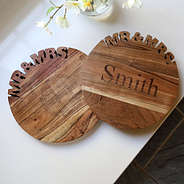 two wedding cutting boards with name and monogram