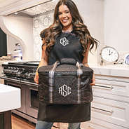 girl carrying monogrammed slow cooker carrier in sable cheetah