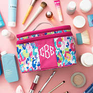 watercolor train case with props pink background