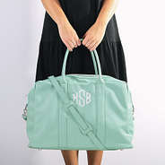 Girl holding Mint Duffel Bag