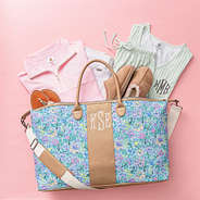 pastel flora trellis charleston weekender flatlay spillshot