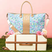 pastel flora trellis charleston weekender on vintage suitcase