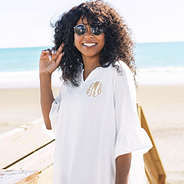 up close of white monogrammed cover up