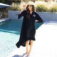 black monogrammed ruffle cover up moving in the breeze