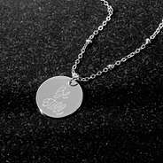 silver Be Still Necklace on granite
