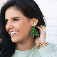 st patricks day beaded earrings in ear