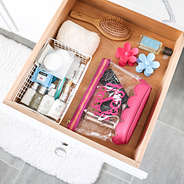 hot pink scalloped cosmetic case in drawer