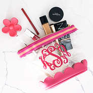 hot pink scalloped cosmetic case flatlay