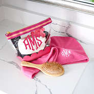 hot pink scalloped cosmetic case with towel