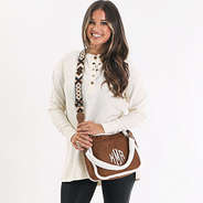 monogrammed suede sherpa crossbody over shoulders