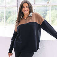 girl wearing eclipse leopard quarter zip sweatshirt