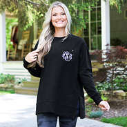 black crewneck sweatshirt on blonde girl by cabin