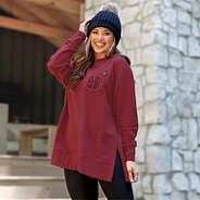 crimson crewneck sweatshirt on brunette with black beanie in mountains
