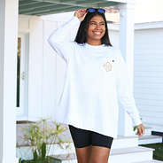 model wearing white crewneck sweatshirt with bike shorts