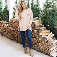 girl wearing heathered oatmeal monogrammed crewneck sweatshirt