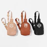 group photo of tan, brown and black monogrammed sling bags