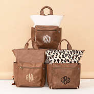trio commuter backpacks in ivory, brown, and classic cheetah