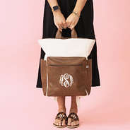 ivory commuter backpack in hands