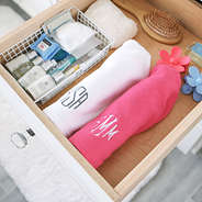 personalized white and pink hair wrap towels in drawer