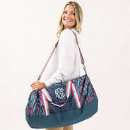 navy safari packable travel bag on shoulder