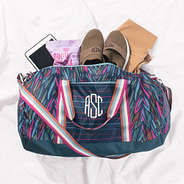 spill shot of navy safari packable travel bag