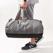 charcoal packable travel bag in hand