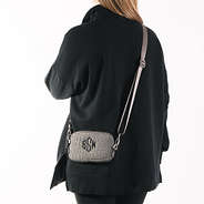 model wearing textured phone crossbody