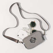 spill shot of taupe textured phone crossbody