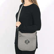 model wearing taupe textured neoprene crossbody