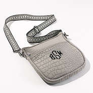 studio shot of taupe textured neoprene crossbody