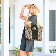 neutral sassy spots tote bag on shoulder