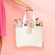ivory tote bag in hand