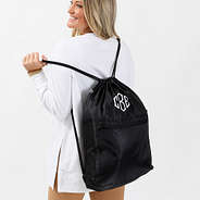 black cinch bag on a girl's back