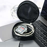 inside of black monogrammed jewelry travel case