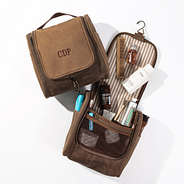 brown personalized waxed canvas hanging toiletry bag flatlay