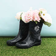 black rain boots with flowers inside