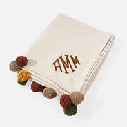 monogrammed pom pom blanket