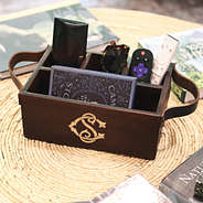 wooden caddy with remotes and sunglasses accessories