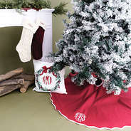 red christmas tree skirt with pillow and stockings