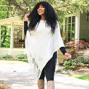 Model wearing Ivory Fringe Poncho