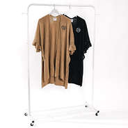 personalized camel and black cardigan ponchos on rack