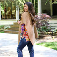 side view of poncho wrap styled with denim outside