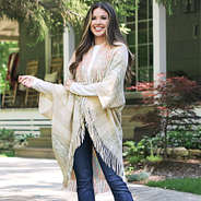 model wearing khaki fringe cardigan at cabin