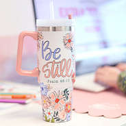 festive travel tumbler by lap top desk