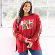 girl wearing christmas holly jolly crimson sweatshirt