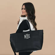 girl carrying Monogrammed Carry On Travel Tote in black