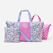 monogrammed travel bag set in orchid garden