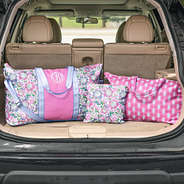 orchid garden monogrammed travel bag sets in car trunk