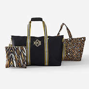 monogrammed travel bag set in black and gold
